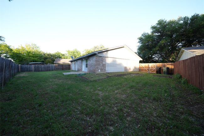 View of yard with a fenced backyard | Image 19