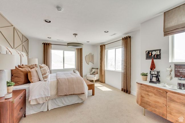 Bedroom with multiple windows and light colored carpet | Image 4