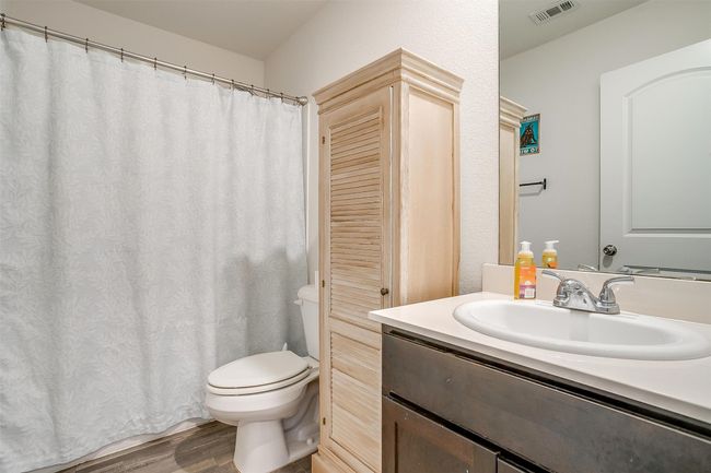 Full bathroom featuring vanity and vinyl floors | Image 20