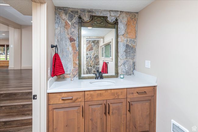 Bathroom with vanity and a textured ceiling | Image 30