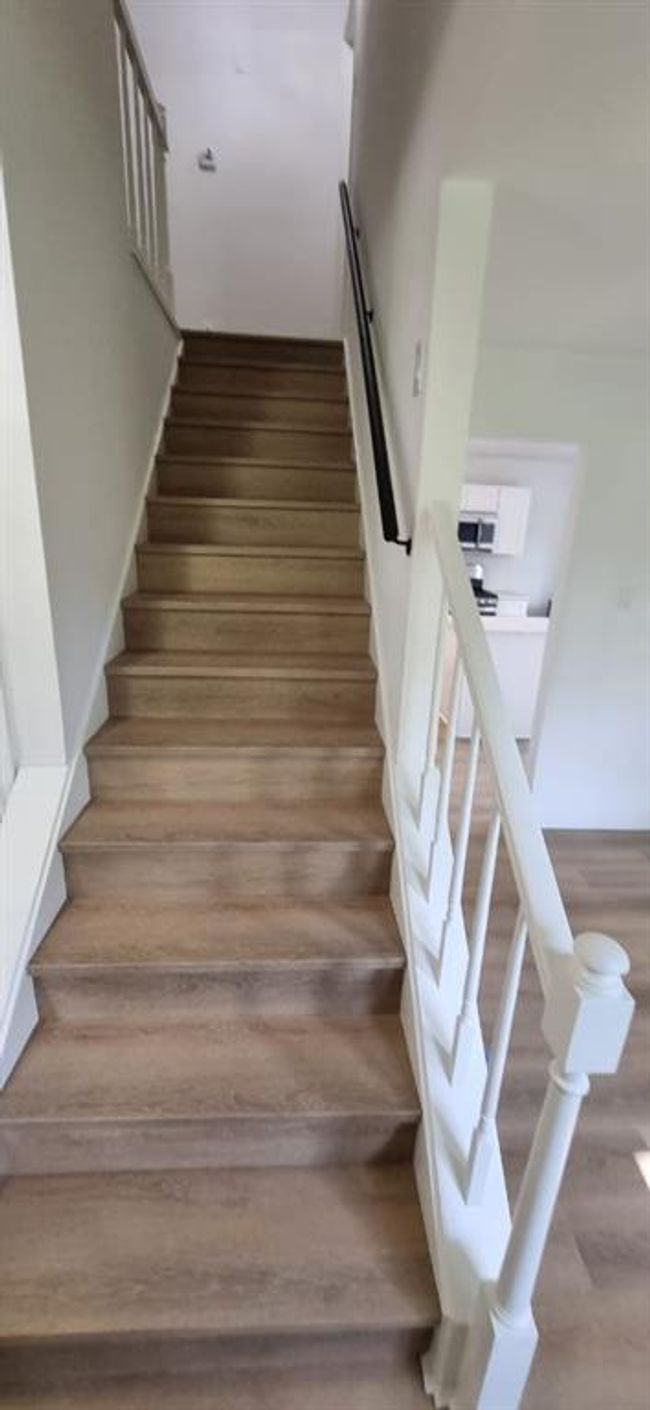 Upstairs you will find the primary bedroom and 3 secondary bedrooms, and laundry room | Image 21