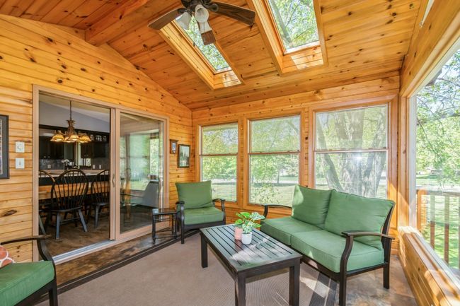 3 season porch is located right off the dining room and will quickly be the go to spot for relaxing! | Image 26