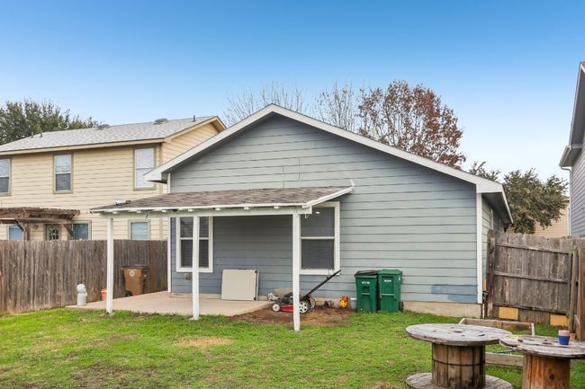 Rear view of property with a lawn, fence, and a patio | Image 19