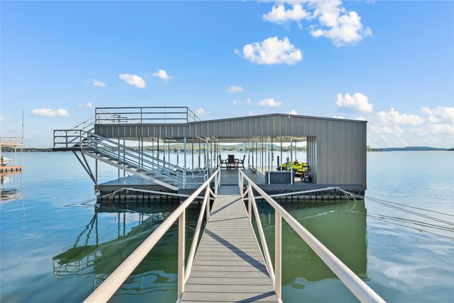 Dock area featuring a water view | Image 6
