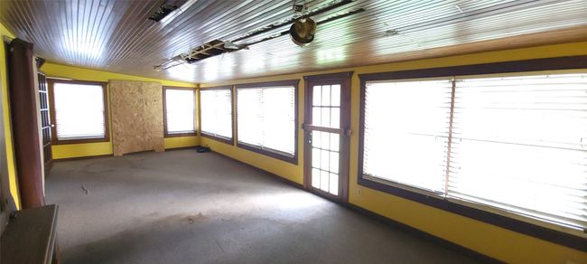 View of unfurnished sunroom | Image 10