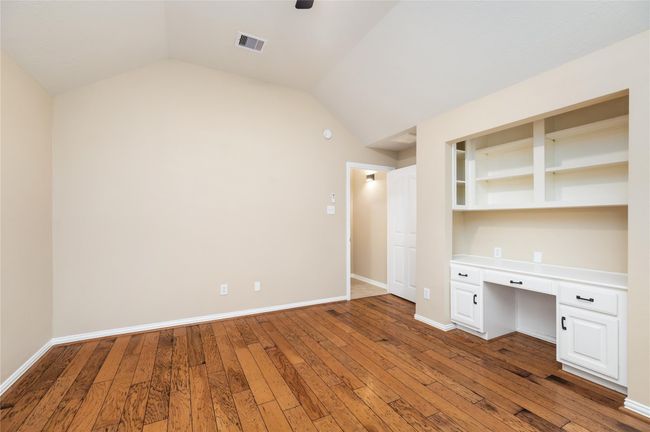 Brimming with character and flexibility, this spacious room is ideal for a study, craft room, creative space, or even a comfortable bedroom. | Image 18