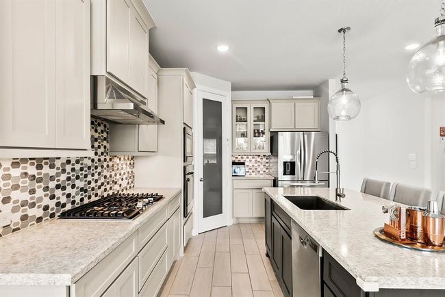 Quartz countertops and a designer backsplash | Image 9