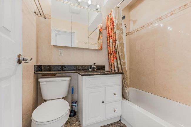 Full bath featuring vanity and shower / bath combination with curtain | Image 19