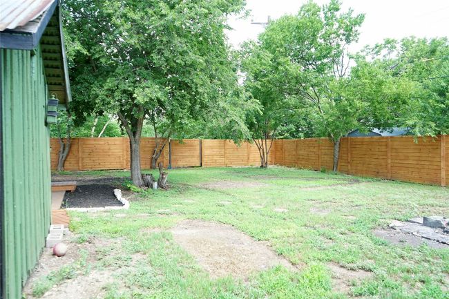 View of fenced backyard | Image 24