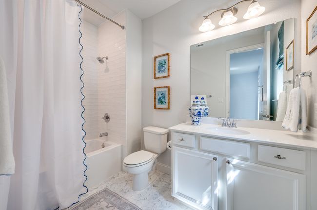 En suite bath was recently remodeled with gorgeous subway tile shower with soaker tub and natural light window. | Image 24