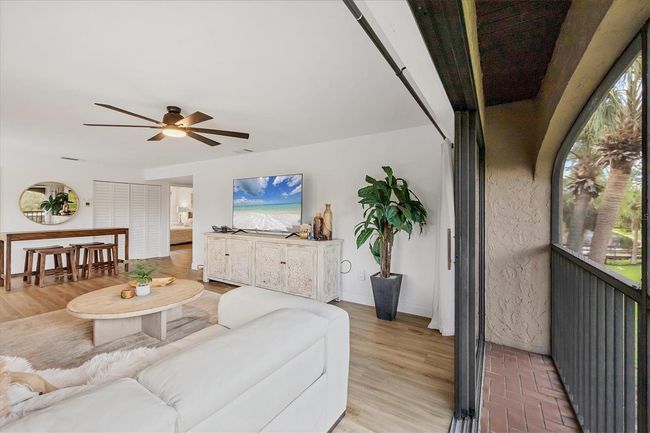 LONG VIEW OF BALCONY OFF OF LIVING ROOM | Image 6