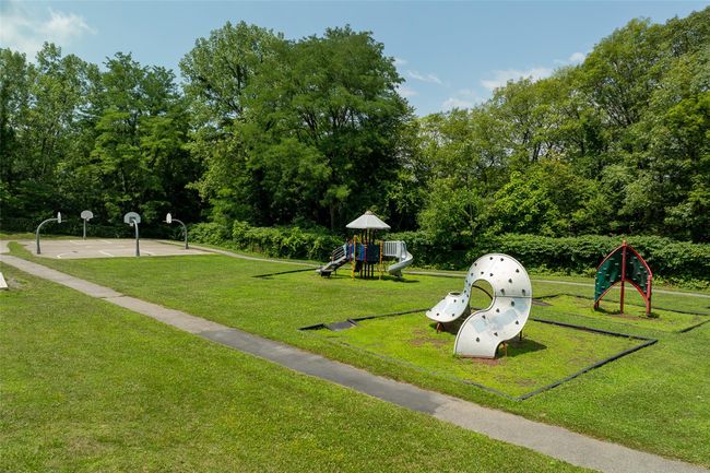 View of home's community with a lawn and playground community | Image 29