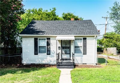 Bungalow-style home with a front yard | Image 1