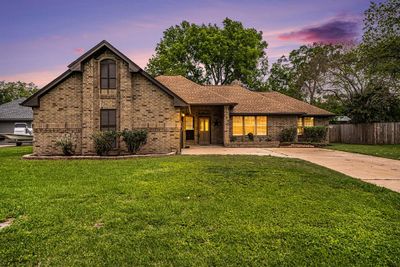 Welcoming view to 130 Juniper within Pecan Lake Estates on Oyster Creek. | Image 1