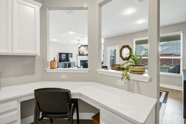 Computer niche features built-in desk and drawers. | Image 18