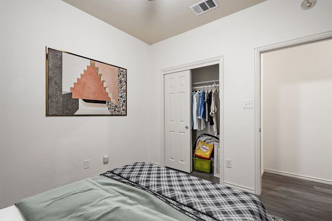 Two additional bedrooms with large closets share a perfectly placed second full bath in the hallway. | Image 32