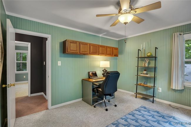 Office area/bedroom with crown molding, light carpet, ceiling fan with light, closet and window | Image 24