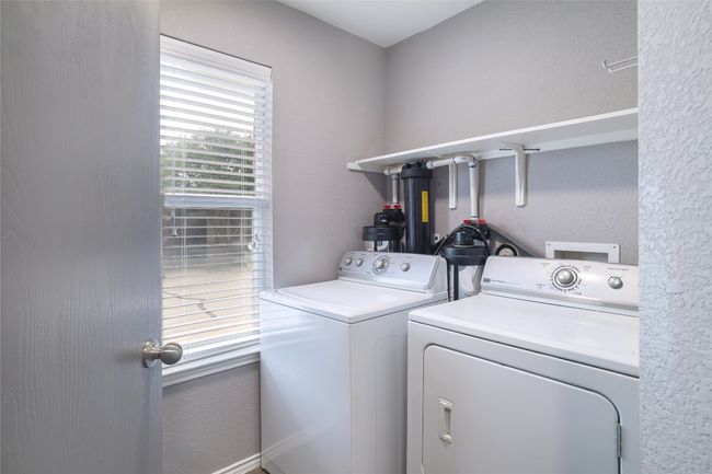 Laundry area with independent washer and dryer | Image 24