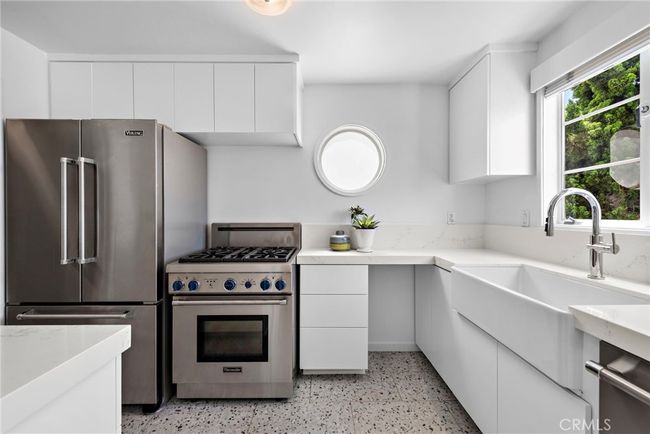 Kitchen with porthole window. | Image 10
