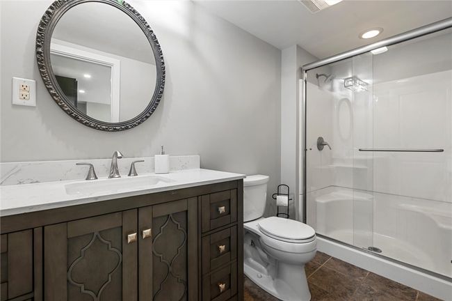 Full bath on the main level with a walk in shower. | Image 9