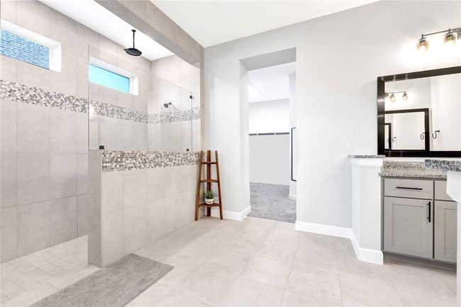 Luxury large walk-in shower and Spacious primary bathroom leads you fluidly to huge primary closet | Image 27