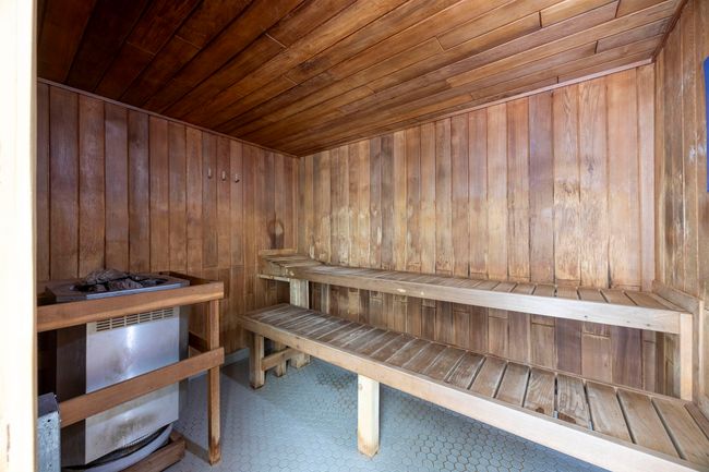 Relaxing sauna / steam room featuring wood ceiling and wooden walls | Image 20