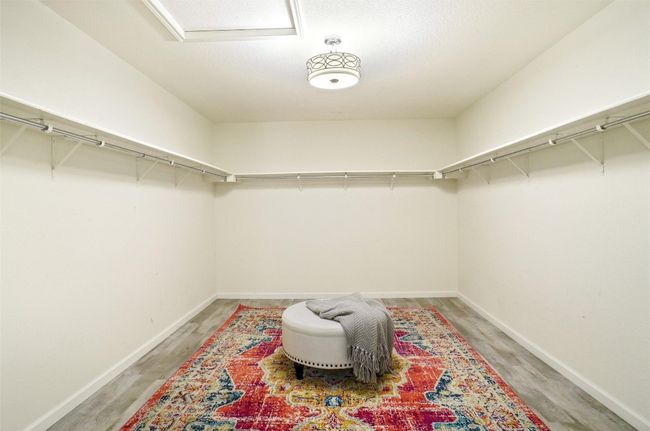 Spacious primary closet for clothes of all seasons, plus built in sweater and shoe racks | Image 22