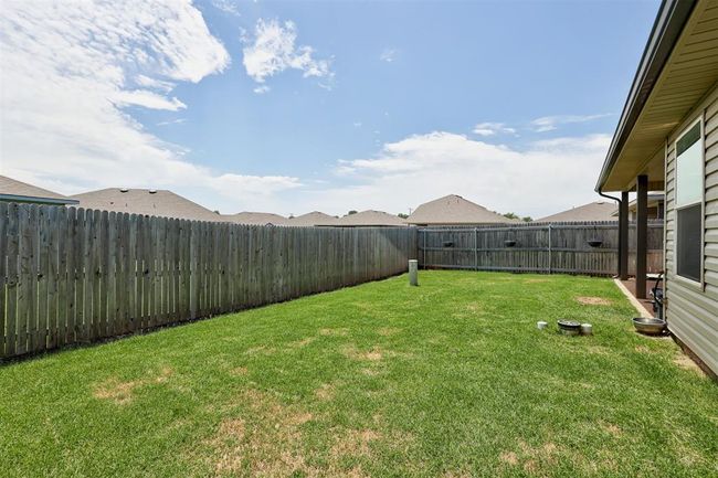 View of fenced backyard | Image 42