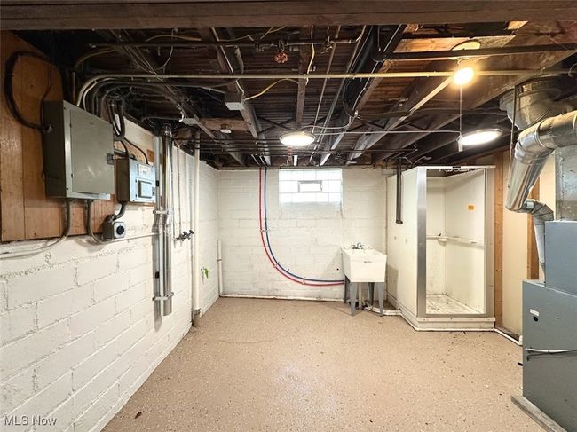 Basement with electric panel | Image 14