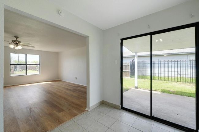 Dining Area Look to Patio and to Family Room | Image 7