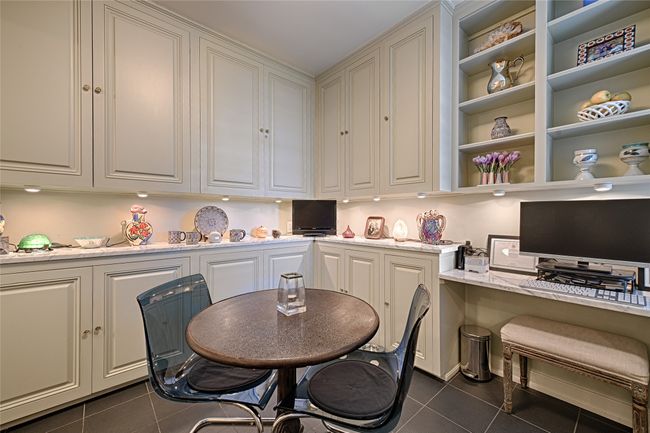 Breakfast room with customer built in cabinets and desk | Image 9