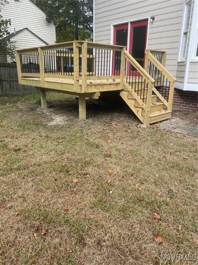 Wooden deck with a lawn | Image 3