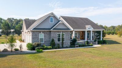 Welcome home to 713 Clarence Finney Road! This custom built home has the best of everything. it features 3 bedrooms, 3 baths an office and a screened porch. All in totally immaculate condition | Image 1