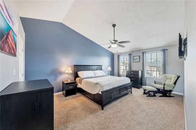 Primary Suite features a vaulted ceiling, walk in closet, and en suite bathroom. | Image 22
