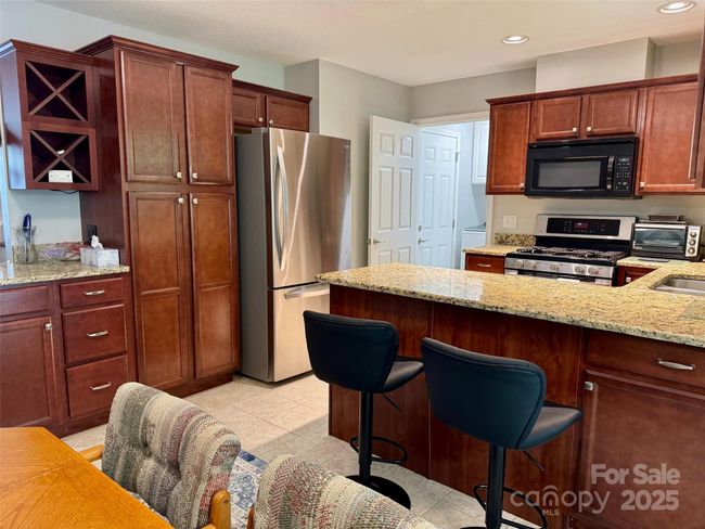View of kitchen from dining area | Image 12
