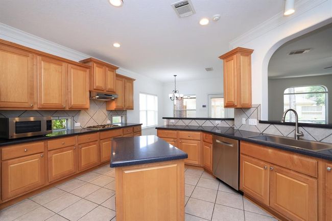 Ample solid wood cabinetry. Center island. | Image 17