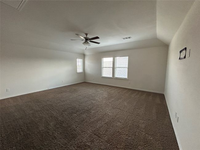 Spare room with carpet flooring, a ceiling fan, and baseboards | Image 23