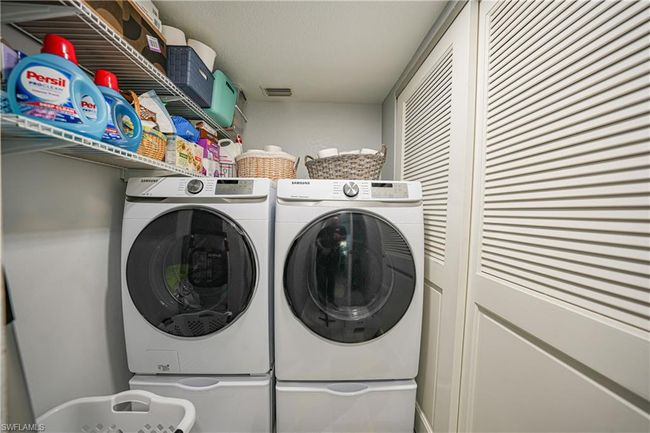 Laundry area with washer and clothes dryer | Image 36