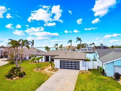 Beautifully Landscaped, Waterfront Home with lots of Curb Appeal on Boca Ciega Bay with fabulous Northwest Views!!!! | Image 3