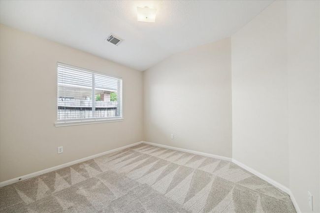 All bedrooms including this secondary bedroom have brand new carpet (May 2025). Perfect for family members or guests, with easy access to the second full bathroom. | Image 18