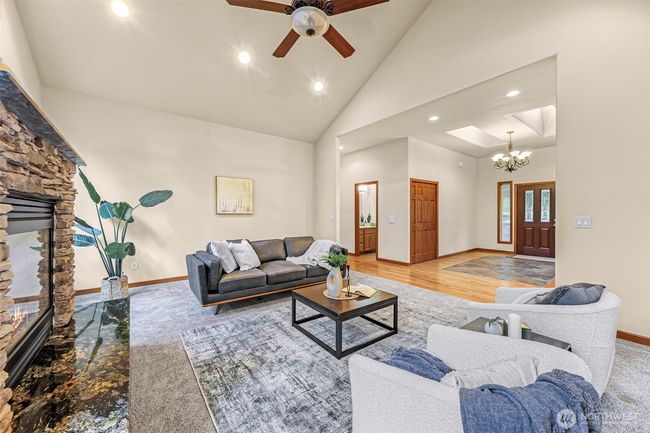 Front door entry has 2 sunlights. Notice the full bathroom accessible from the living area | Image 7