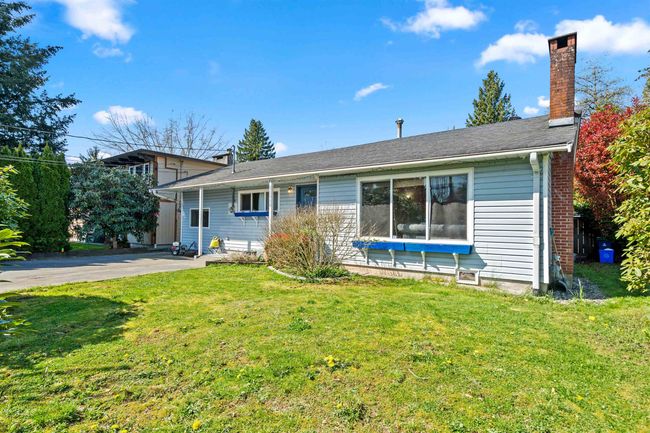 View of front of home featuring a chimney and a front lawn | Image 27