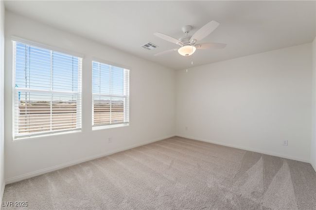 Spare room featuring carpet flooring and ceiling fan | Image 28
