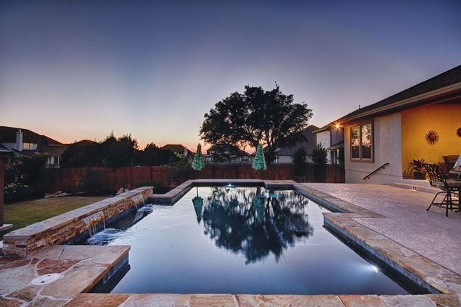 Backyard Oasis with Sparkling Pool, Pergola, and Outdoor Kitchen | Image 39