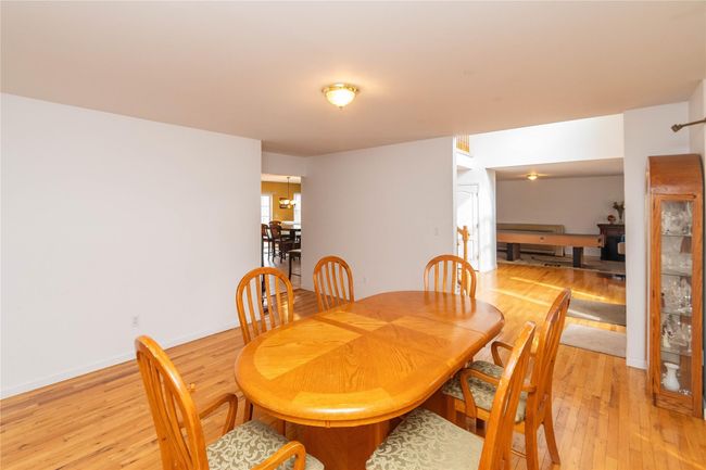 Dining space with baseboards and light wood-style flooring | Image 22