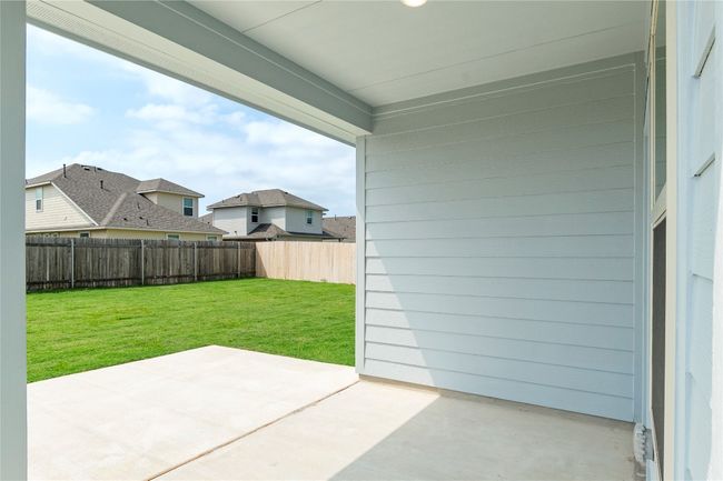 Fenced backyard featuring a patio area | Image 28