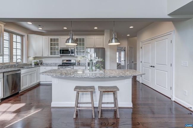 Large double-door pantry for extra kitchen storage. | Image 8