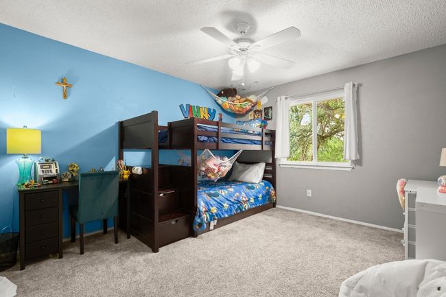 The guest bedrooms are generously sized, offering comfort and privacy with plenty of natural light, making them ideal for family or visitors to feel right at home | Image 22