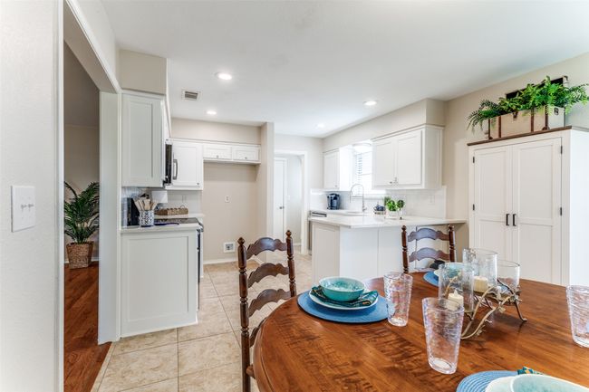Dining area featuring light tile patterned flooring and recessed lighting | Image 16