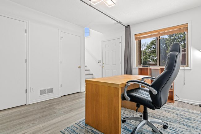 Family room currently staged as an office | Image 20
